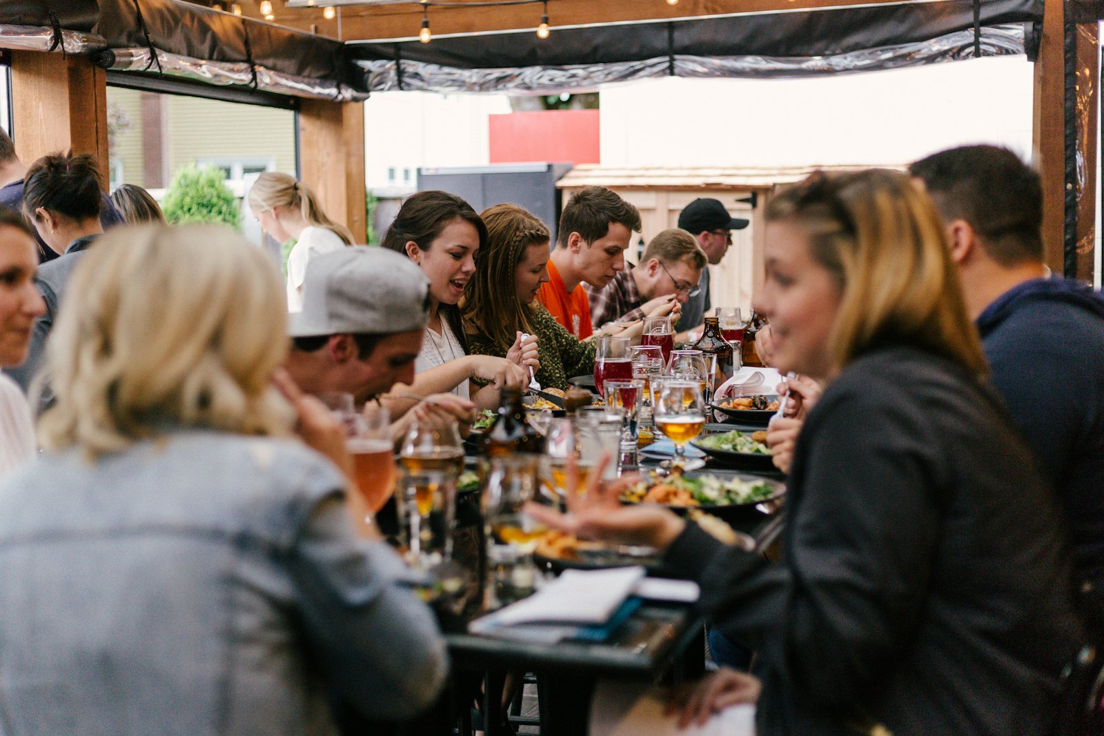 A full dining room of guests eating and talking