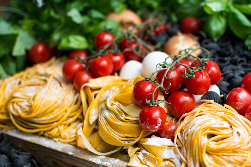 Nests of fresh tagliatelle with tomatoes and herbs