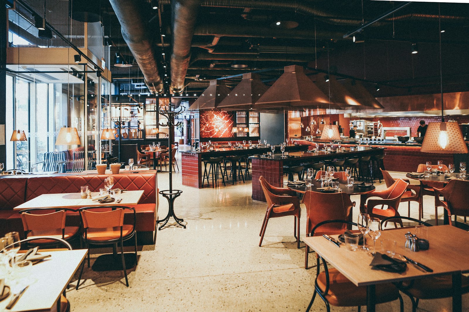 Warmly lit private dining space set for a group at Orlo