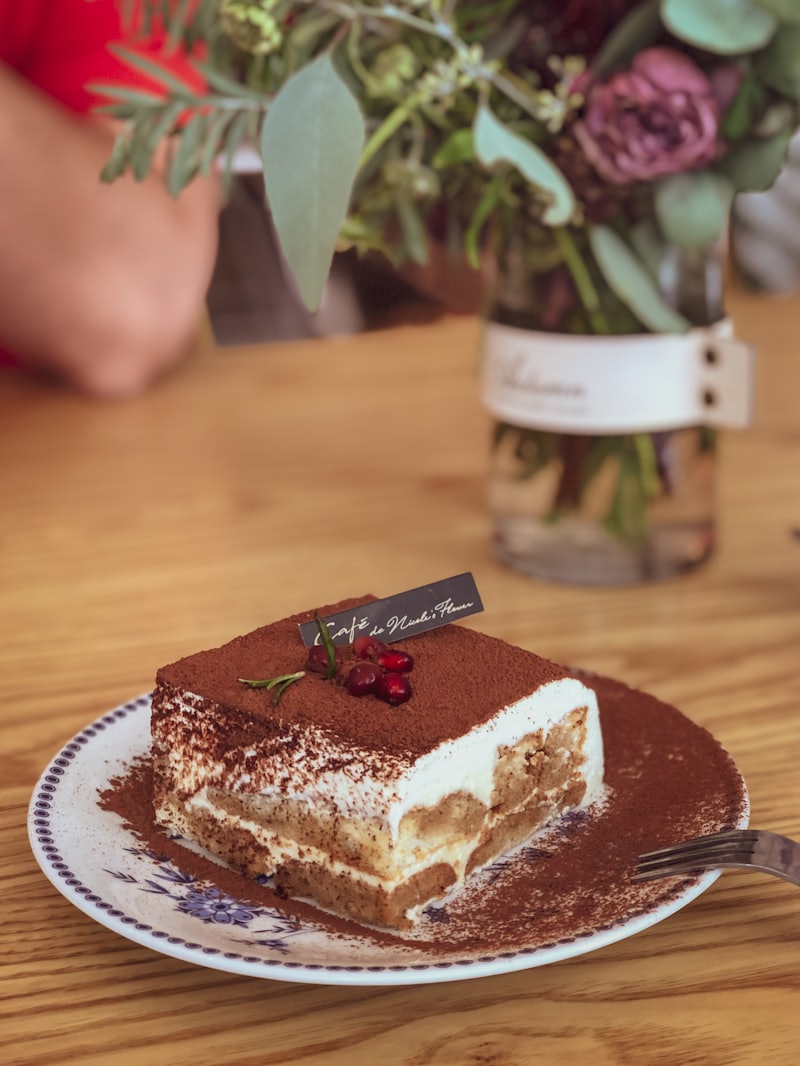 A slice of tiramisù dusted with cocoa