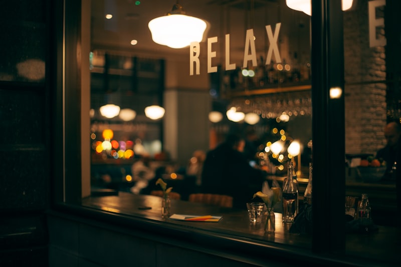 Warm light through the front window of the restaurant at night